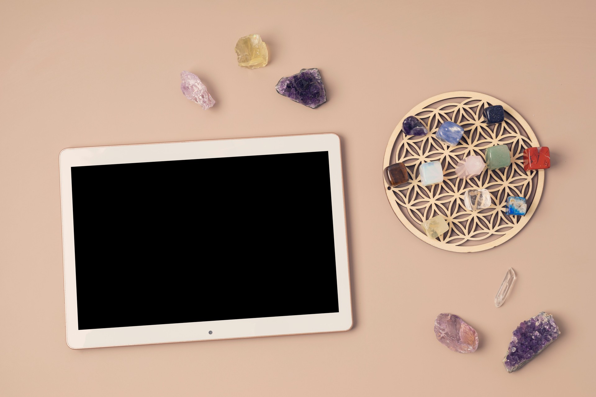 Healing chakra crystals and tablet mockup. Online application for rituals with gemstones for career, wellness, business, relaxation, mental health, spiritual practices. Energetical power concept